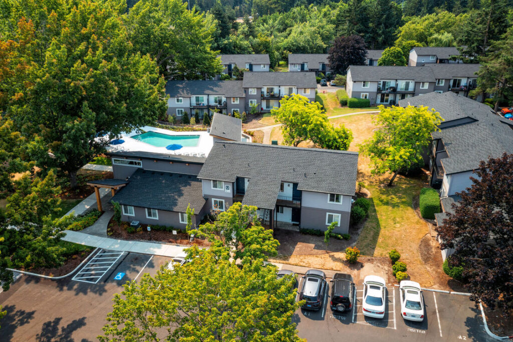 aerial view of property with large trees