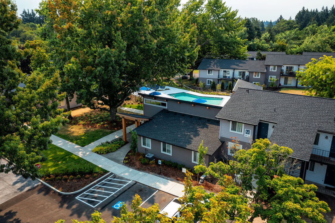 aerial view of property with large trees