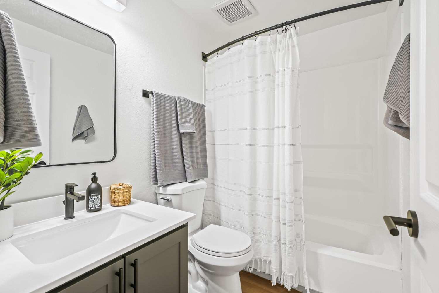 Bathroom with toilet and tub shower